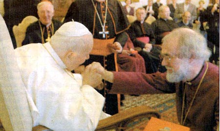 Pope John Paul II kissing the hand of Rowan Williams
